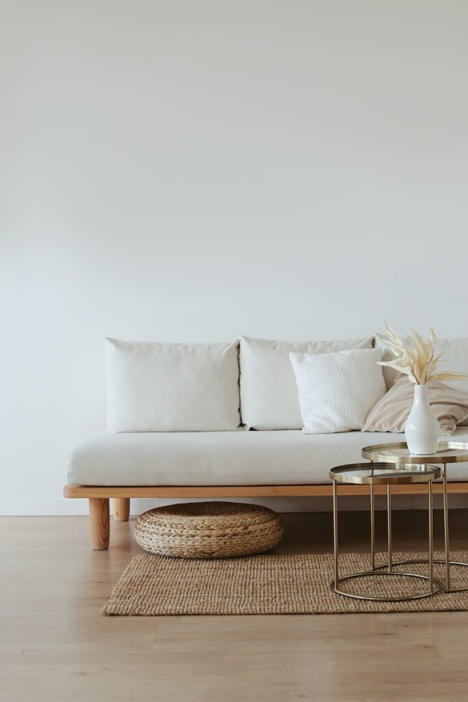 White Couch on Wooden Floor